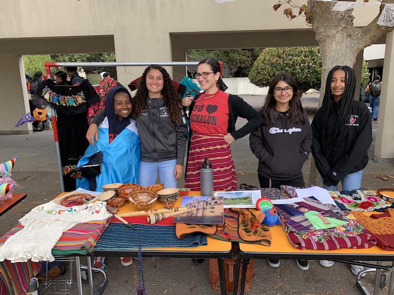 Saint Mary's Celebration Culture and Heritage Day Girls with Teacher at LatinX Table